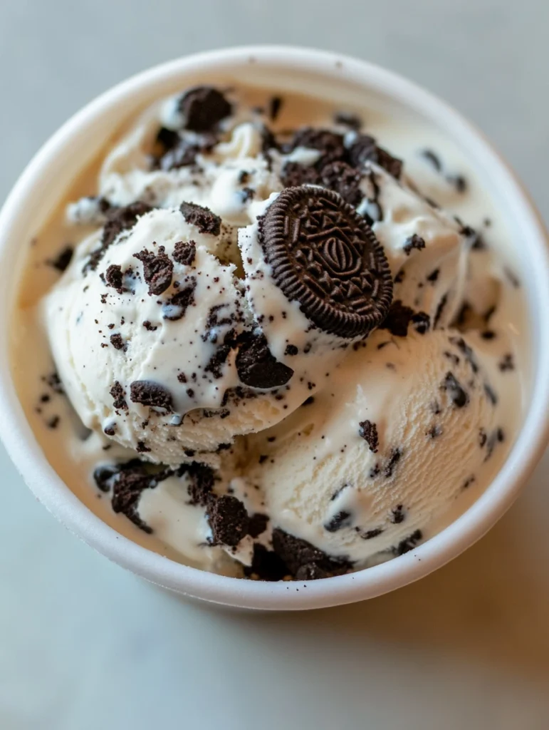 Oreo ice cream in a bowl, featuring a creamy cookies and cream texture with chunks of Oreo cookies throughout.