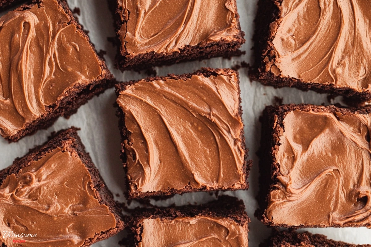 Delicious close-up of hershey brownie recipe topped with rich frosting, showcasing a tempting dessert made from a Hershey recipe.