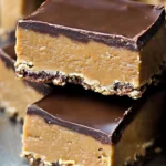 Delicious no-bake chocolate peanut butter bars, perfectly layered and ready to satisfy your sweet tooth.