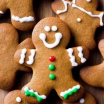 Gingerbread cookies featuring cheerful smiling faces, beautifully decorated and ready for the festive season.