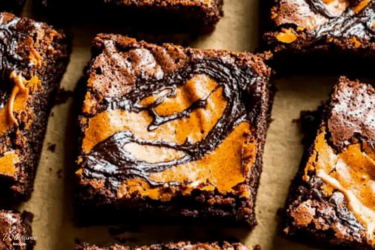 Pumpkin Brownies topped with luscious caramel swirls, featuring a hint of pumpkin for a seasonal twist.