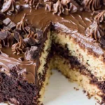 A German chocolate cake with a slice removed, showcasing its rich layers and decadent frosting.