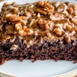 Delicious german chocolate sheet cake on a plate, showcasing layers of rich chocolate and creamy peanut butter frosting.