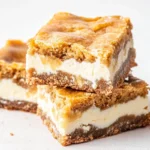 Delicious pumpkin cream cheese bars with a smooth, creamy texture and a sprinkle of cinnamon on top. Perfect fall treat!