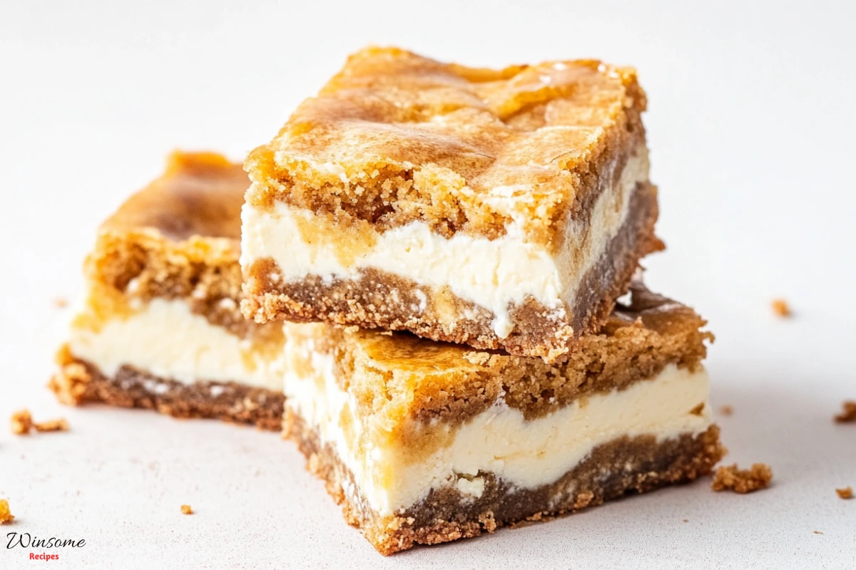 Delicious pumpkin cream cheese bars with a smooth, creamy texture and a sprinkle of cinnamon on top. Perfect fall treat!